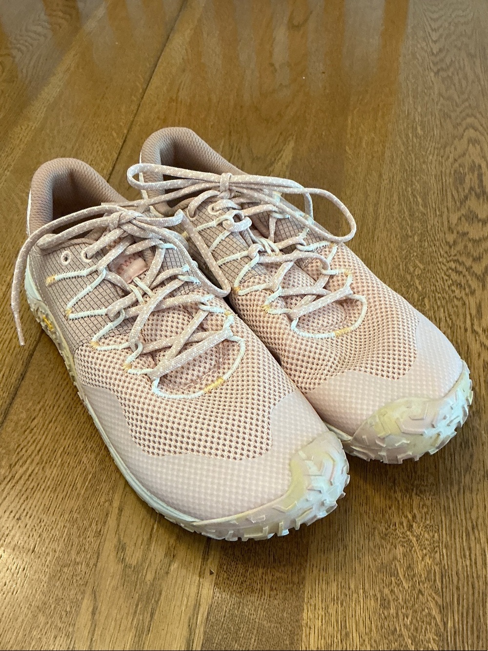 Woman’s Merrell baby pink tie shoes. Size 10. Knit. Vibram sole. Preowned.